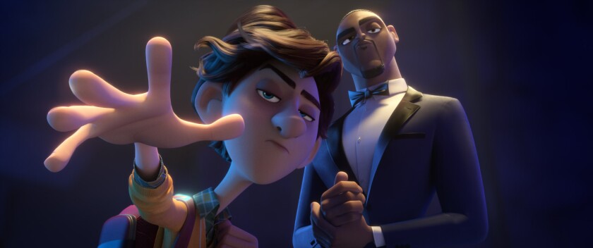 Walter (voiced by Tom Holland, left) and Lance Sterling (Will Smith) in the animated movie “Spies in Disguise.”