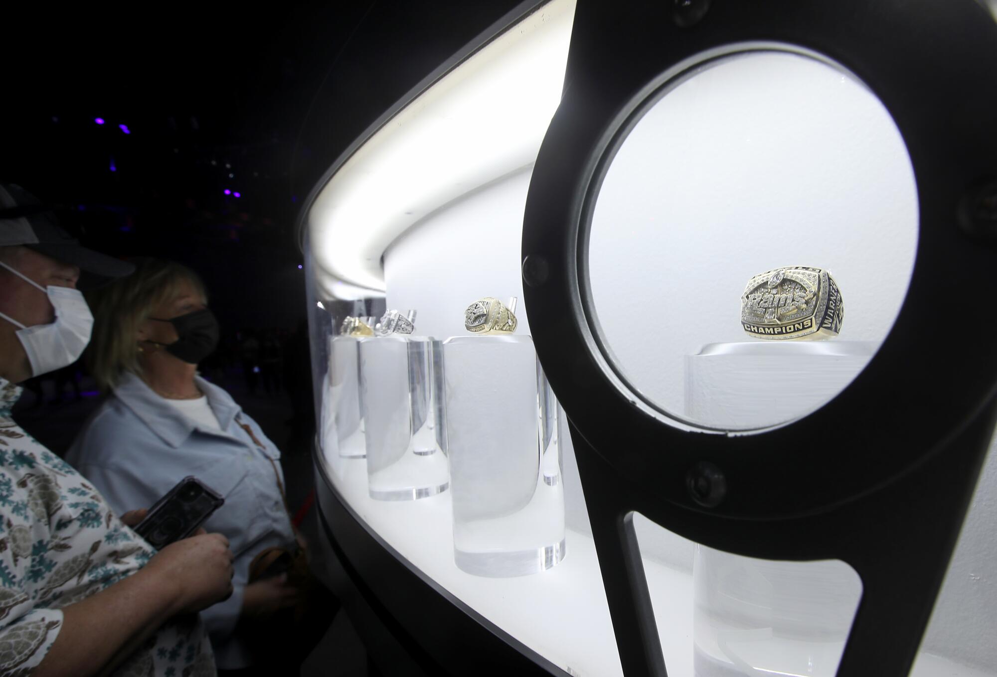 A Rams Super Bowl ring is part of a display at the Super Bowl Experience.