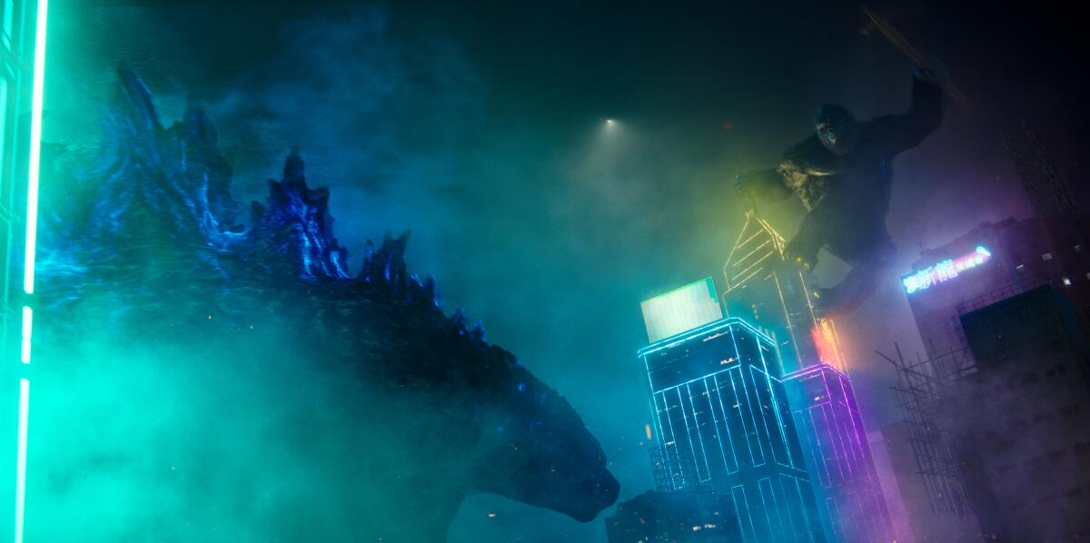 King Kong jumping toward Godzilla