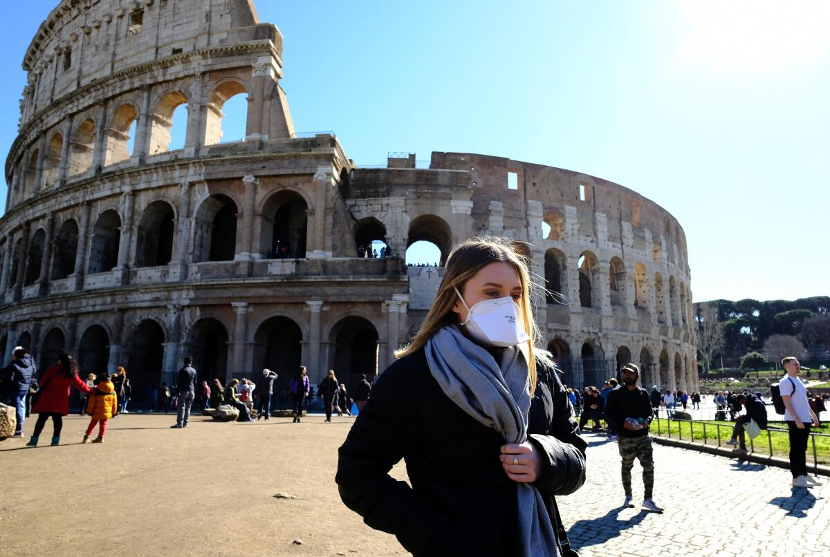 A masked tourist at Rome's Coliseum