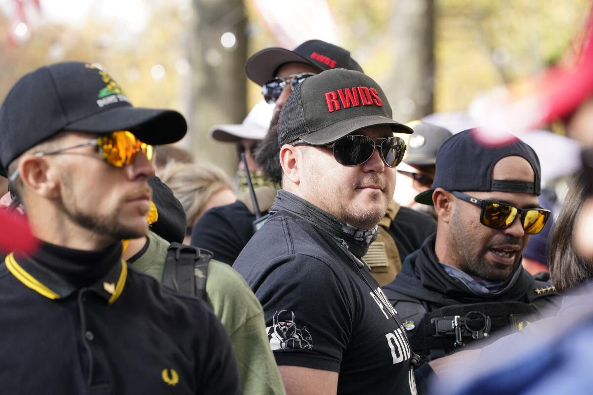 People identifying themselves as members of the Proud Boys 