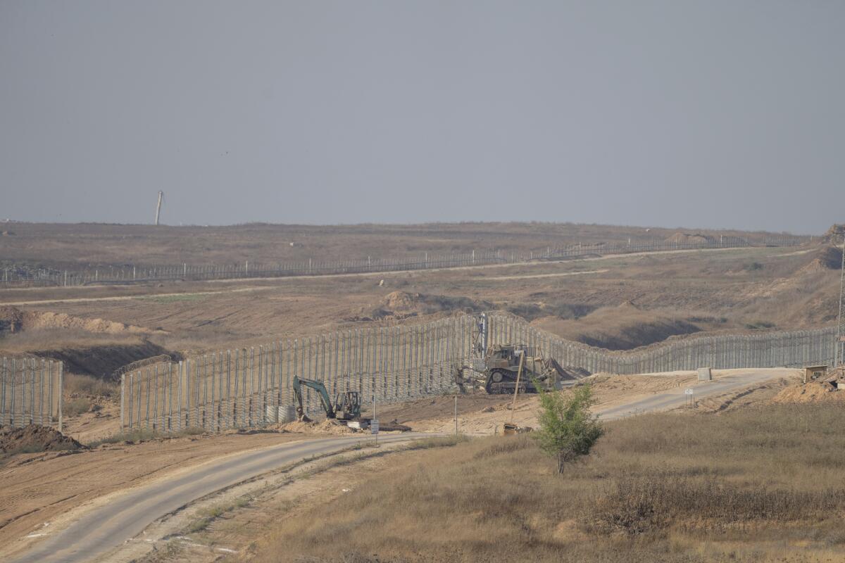 Israeli army bulldozers near the Gaza Strip border, in southern Israel.