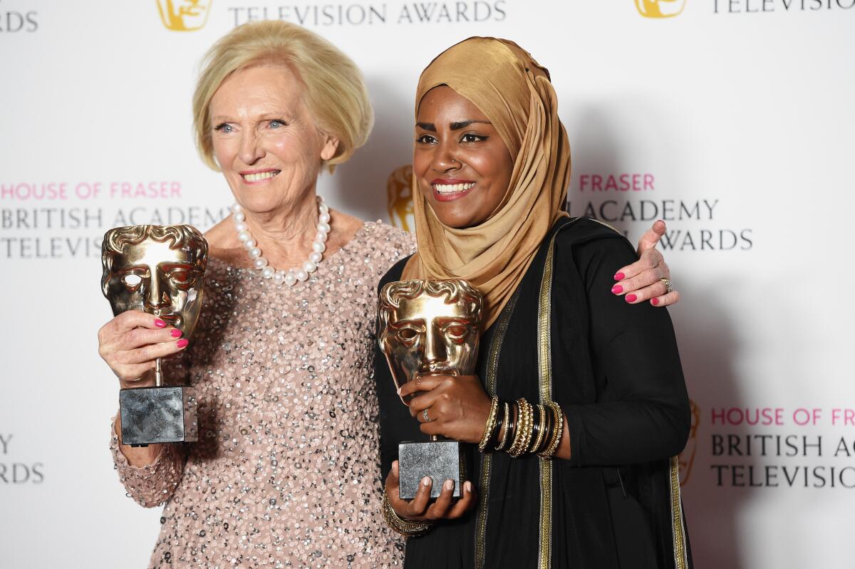 Mary Berry, accepting the Feature award for 'The Great British Bake Off' and winner Nadiya Hussain at the House Of Fraser British Academy Television Awards 2016.