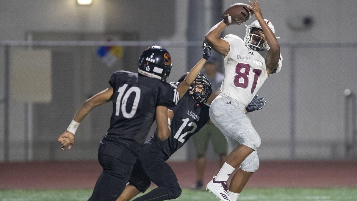 Ocean View High's Naeco Logan, pictured making one of his three receptions on Aug. 23 against Los Amigos, turned all three of them into touchdowns.