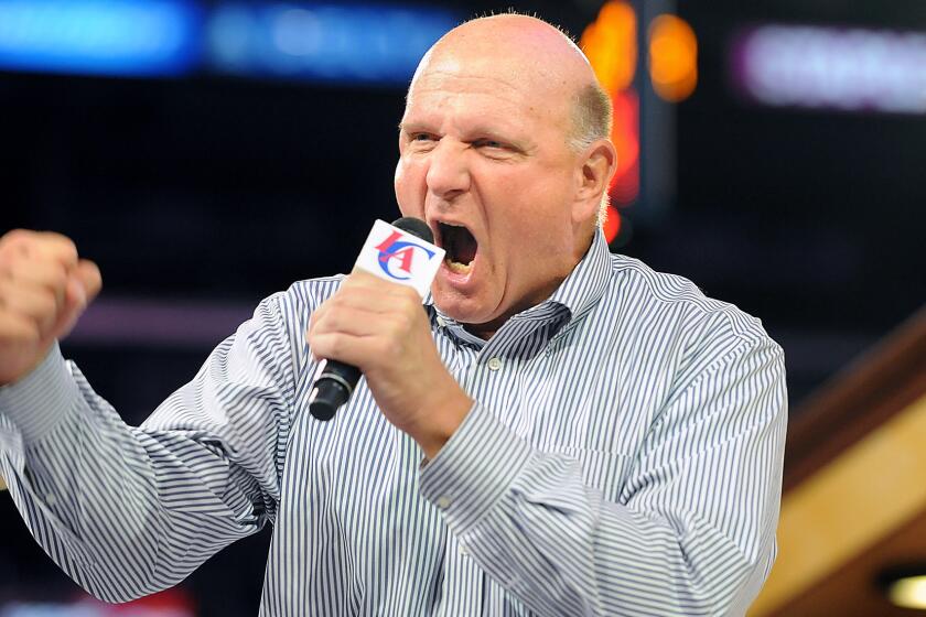 Clippers owner Steve Ballmer speaks during a rally at Staples Center in August. Will Ballmer's overenthusiastic demeanor become his courtside trademark?