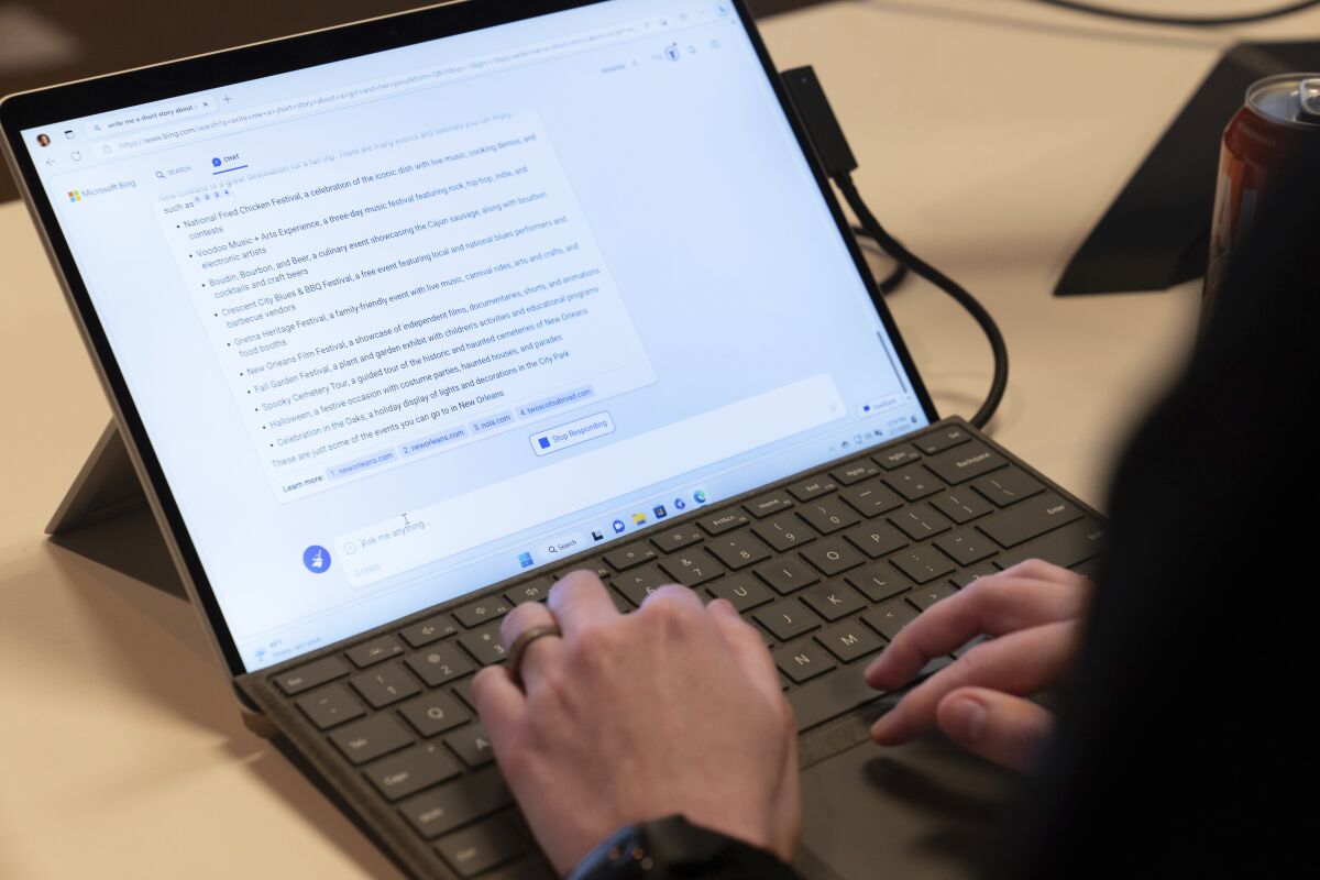 Microsoft employee Alex Buscher demonstrates a search feature integration of Microsoft Bing search engine and Edge browser with OpenAI on Tuesday, Feb. 7, 2023, in Redmond. (AP Photo/Stephen Brashear)