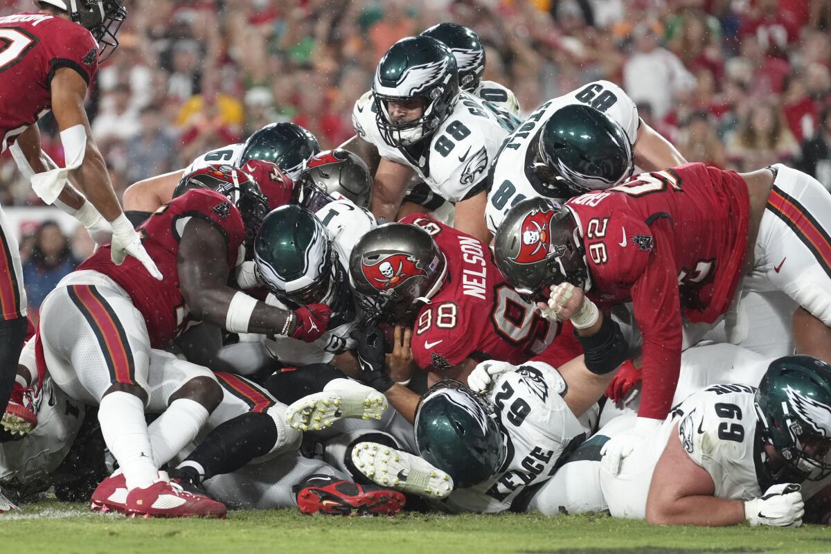 Eagles quarterback Jalen Hurts (1) sneaks for a touchdown against the Buccaneers in September.