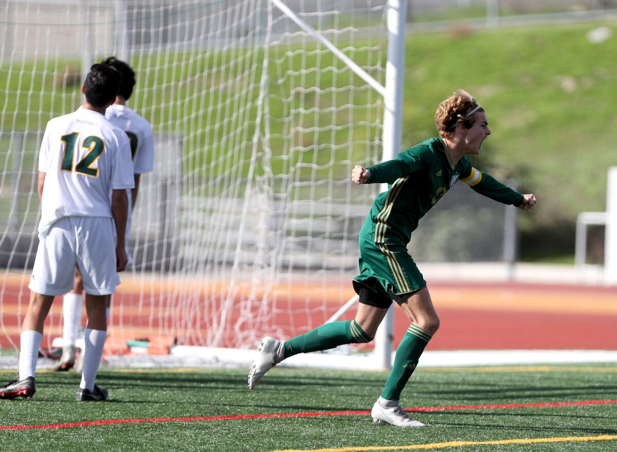 Edison boys' soccer player Ethan Van Buren celebrates scoring a goal to tie the game in the Hawks Invitational championship match versus Manhattan Beach Mira Costa at Laguna Hills High on Saturday.