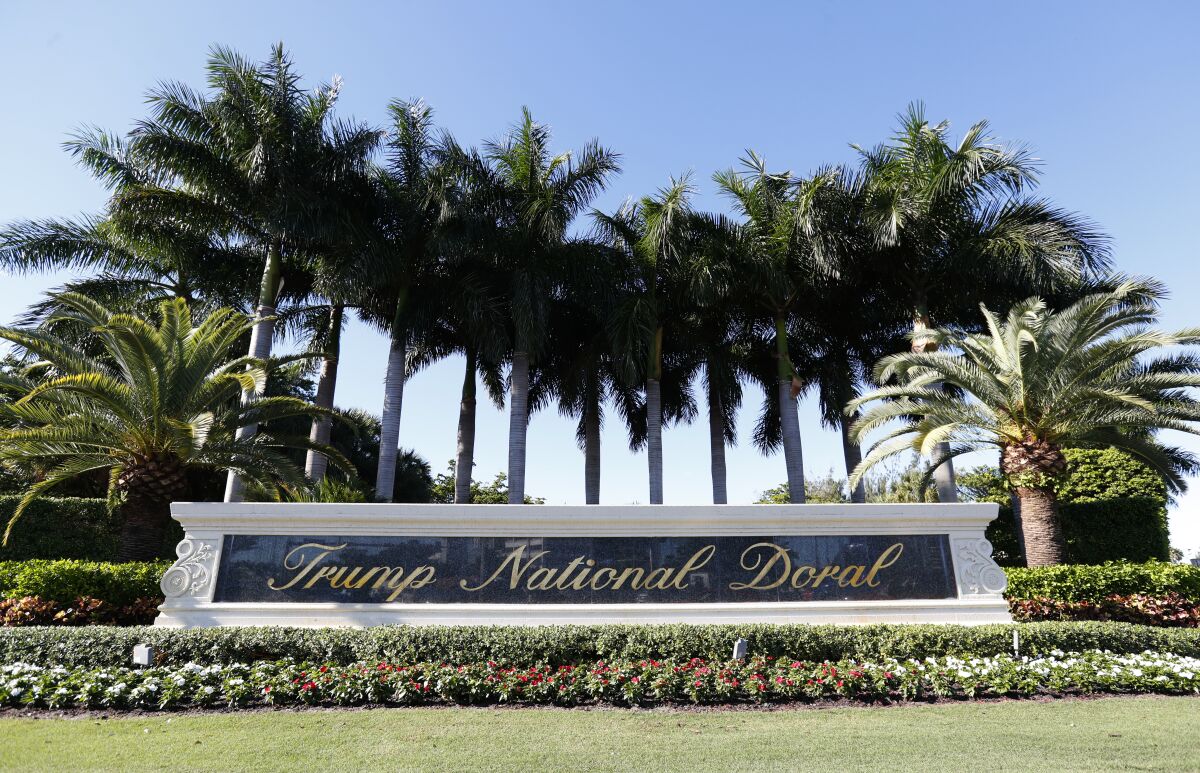 FILE - In this Nov. 20, 2019 file photo, the entrance to the Trump National Doral resort is shown in Doral, Fla. Donald Trump plans to build thousands of new luxury homes at his struggling Doral golf club in hopes of reviving the fortunes of the Miami-area property. The club is the biggest revenue generator in his golf business, but has suffered from a one-two punch of a divisive presidency that led groups to cancel events followed by coronavirus shutdowns. (AP Photo/Wilfredo Lee, file)