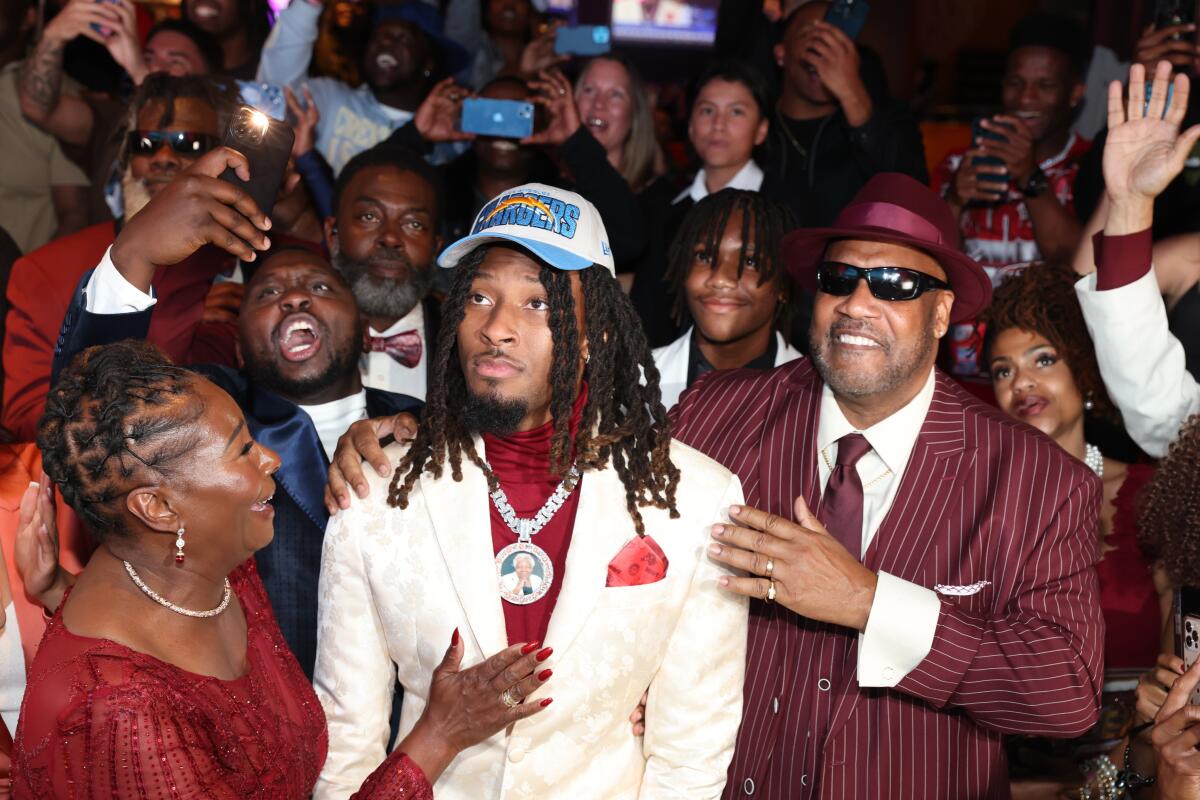 Wide receiver Quentin Johnston celebrates being drafted by the Chargers in the first round.
