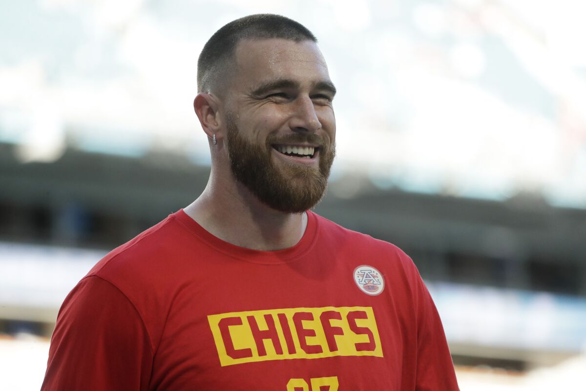 FILE - Kansas City Chiefs' Travis Kelce smiles before the NFL Super Bowl 54 football game between the San Francisco 49ers and Kansas City Chiefs Sunday, Feb. 2, 2020, in Miami Gardens, Fla. The Chiefs and the star tight end have agreed to a four-year, $57.25 million contract extension that will keep him with the Super Bowl champions through 2025, a person familiar with the contract tells The Associated Press. The person spoke on condition of anonymity Thursday because the deal has not been announced. (AP Photo/Wilfredo Lee)