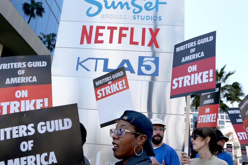 Los Angeles, CA - May 02: Striking Writers Guild of America workers picket outside the Sunset Bronson Studios on Tuesday, May 2, 2023. Los Angeles on Tuesday, May 2, 2023 in Los Angeles, CA. (Luis Sinco / Los Angeles Times)