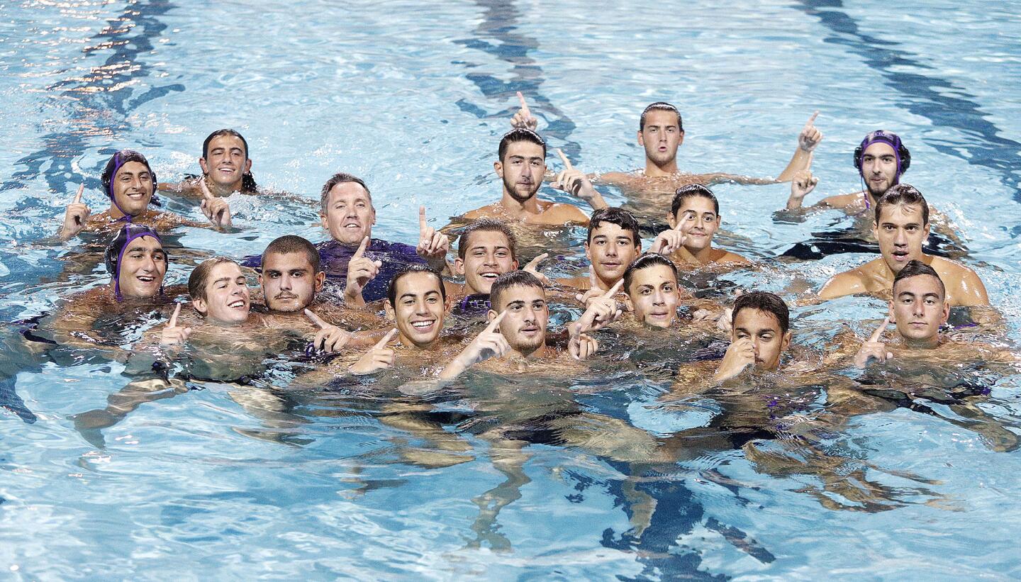 The Hoover boys' water polo team poses with number one fingers raised after defeating Arcadia in the Pacific League boys' water polo championship at Arcadia High School on Thursday, October 25, 2018. Hoover defeated Arcadia.