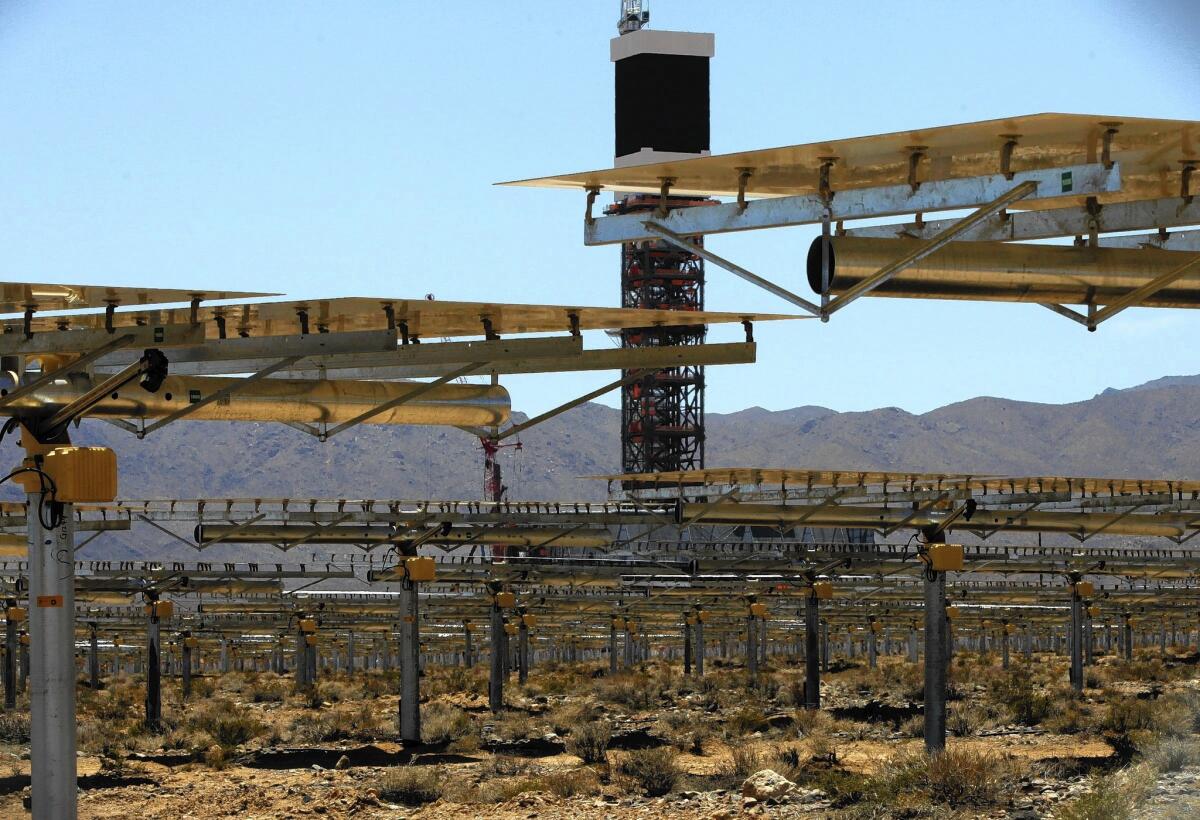 BrightSource Energy's Ivanpah solar facility under construction in 2012 in California's Ivanpah Valley, near the Nevada state line. Five years after the Obama administration's renewable energy initiative touched off a building boom of large-scale solar power plants across the desert Southwest, the pace of development has slowed to a crawl.