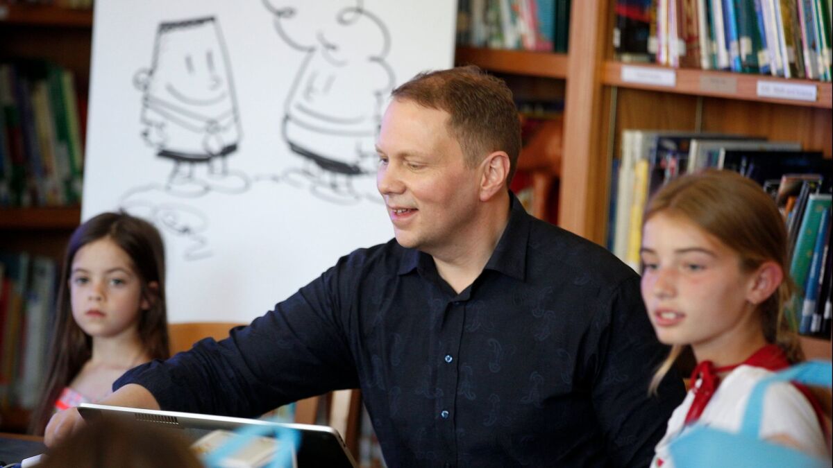 Dav Pilkey, the author of the "Captain Underpants" book series, meets with kids at Overland Avenue Elementary on May 19. He was accompanied by David Soren, the director of "Captain Underpants: The First Epic Movie," which opens June 2.