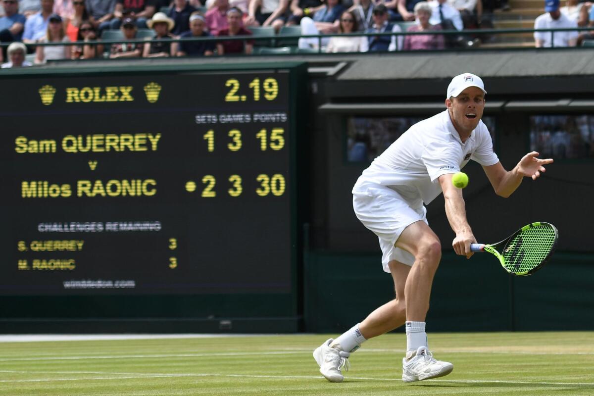 Sam Querrey runs down a shot during a July 6 Wimbledon against Milos Raonic.