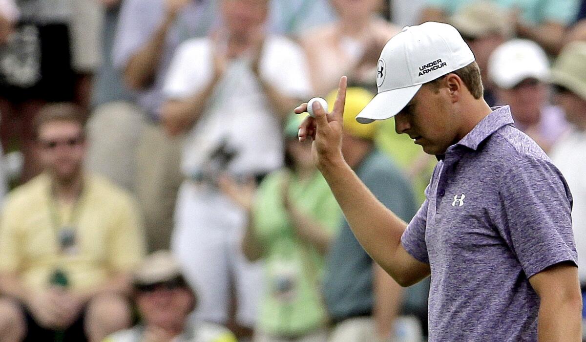 Jordan Spieth acknowledges the applause of the spectators after making a birdie at No. 10 on Friday during the second round of the Masters.