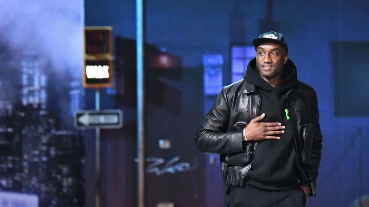 Virgil Abloh, Louis Vuitton's men's artistic director, acknowledges the audience at the end of the Louis Vuitton men's fall and winter 2019 collection fashion show in Paris on Jan. 17.