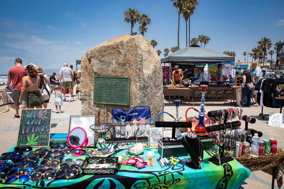 Street vendors offer their wares at Veterans Plaza in Ocean Beach in July.