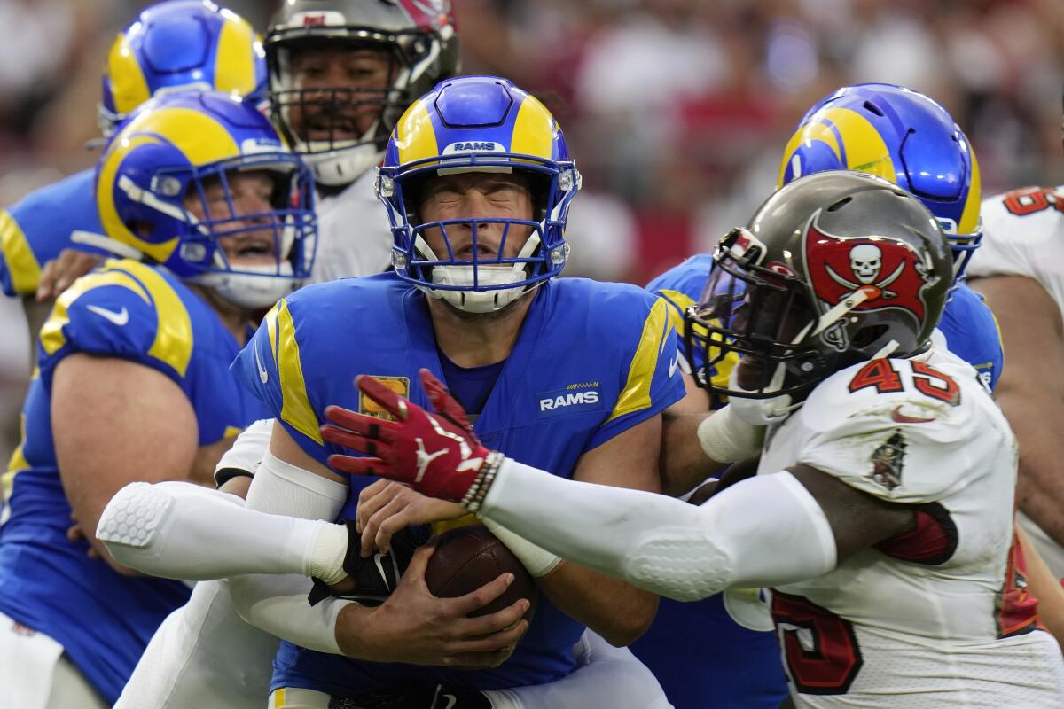 Rams quarterback Matthew Stafford is sacked by Tampa Bay Buccaneers linebacker Devin White.