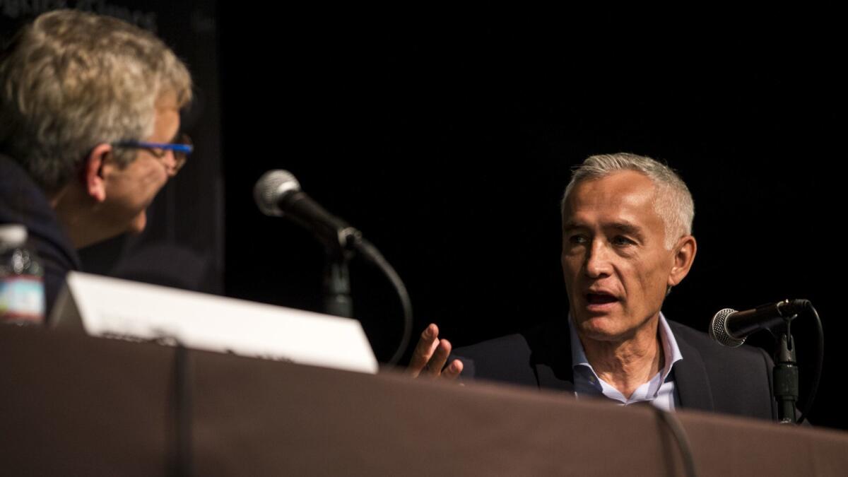 David Kipen, left, speaks with journalist Jorge Ramos during a panel Saturday at the Los Angeles Times Festival of Books.