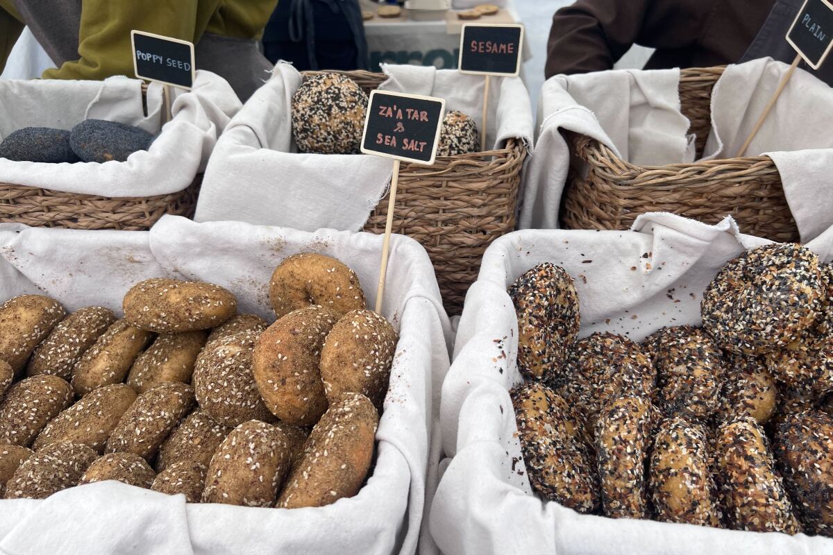 Baskets of bagels at a farmers market.