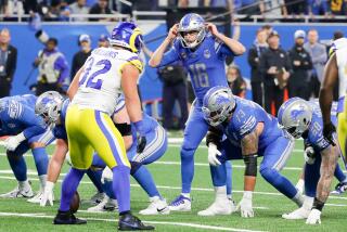 Lions quarterback Jared Goff (16) signals from the line against his former team, the Rams.