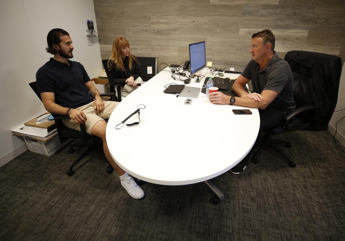 New Kings player Phillip Danault with his wife Marie meet with general manager Rob Blake.