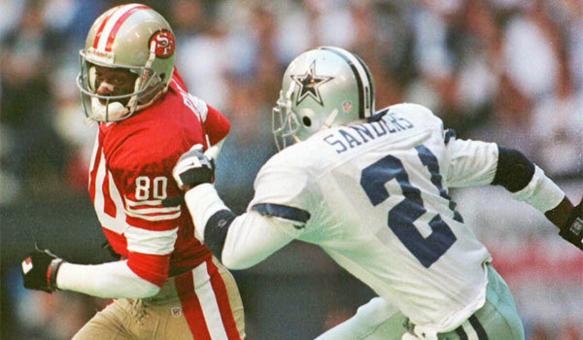 Jerry Rice and Deion Sanders, shown during their playing days in 1996, will be captains for the NFL's Pro Bowl draft in January.