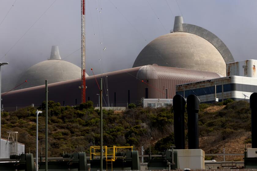 SAN LUIS OBISPO, CA - AUGUST 9, 2024 - Twin containment domes, that house the nuclear reactors, clear the morning fog at the Diablo Nuclear Power Plant in San Luis Obispo on August 9, 2024. (Genaro Molina/Los Angeles Times)