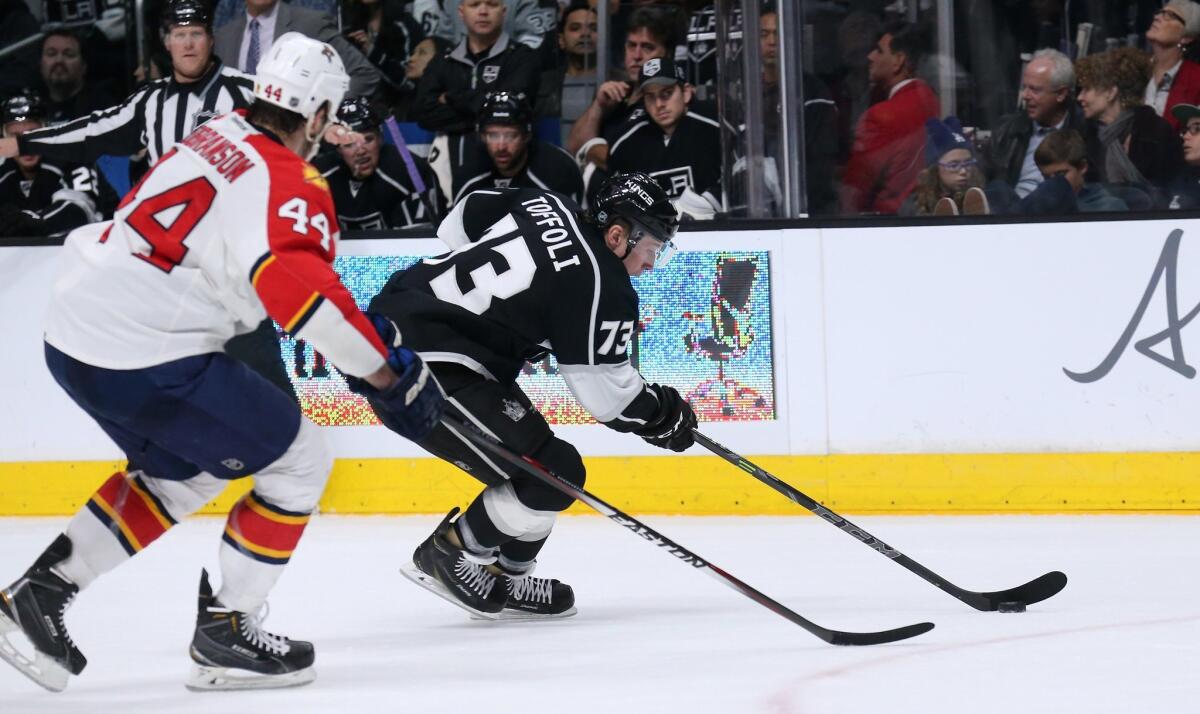 Tyler Toffoli, right, skates the puck away from Florida's Erik Gudbranson during the Kings' 5-2 win Nov. 18 at Staples Center.