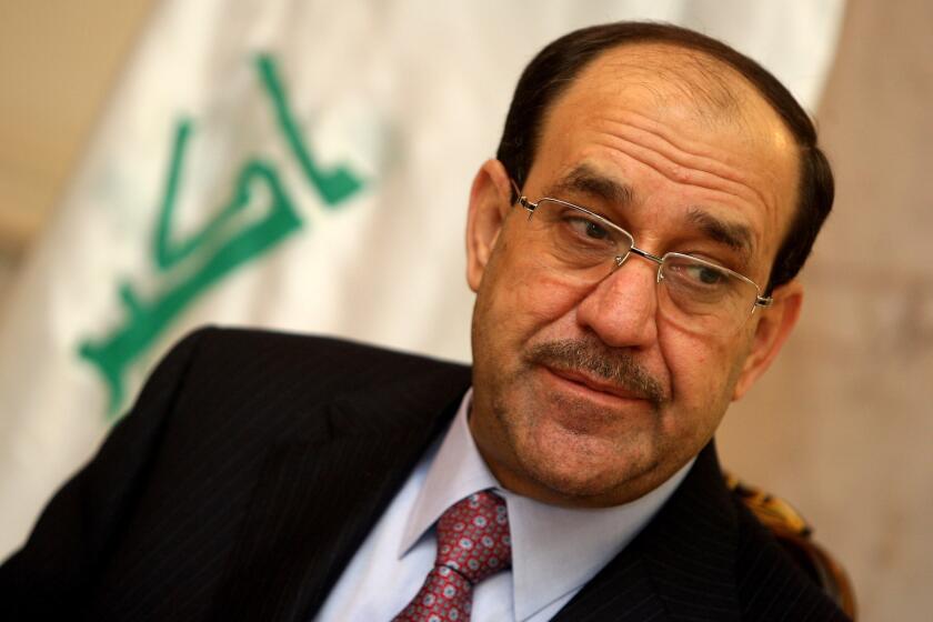Former Iraqi Prime Minister Nouri Maliki listens to a question during an interview in Baghdad on Feb. 5, 2011.