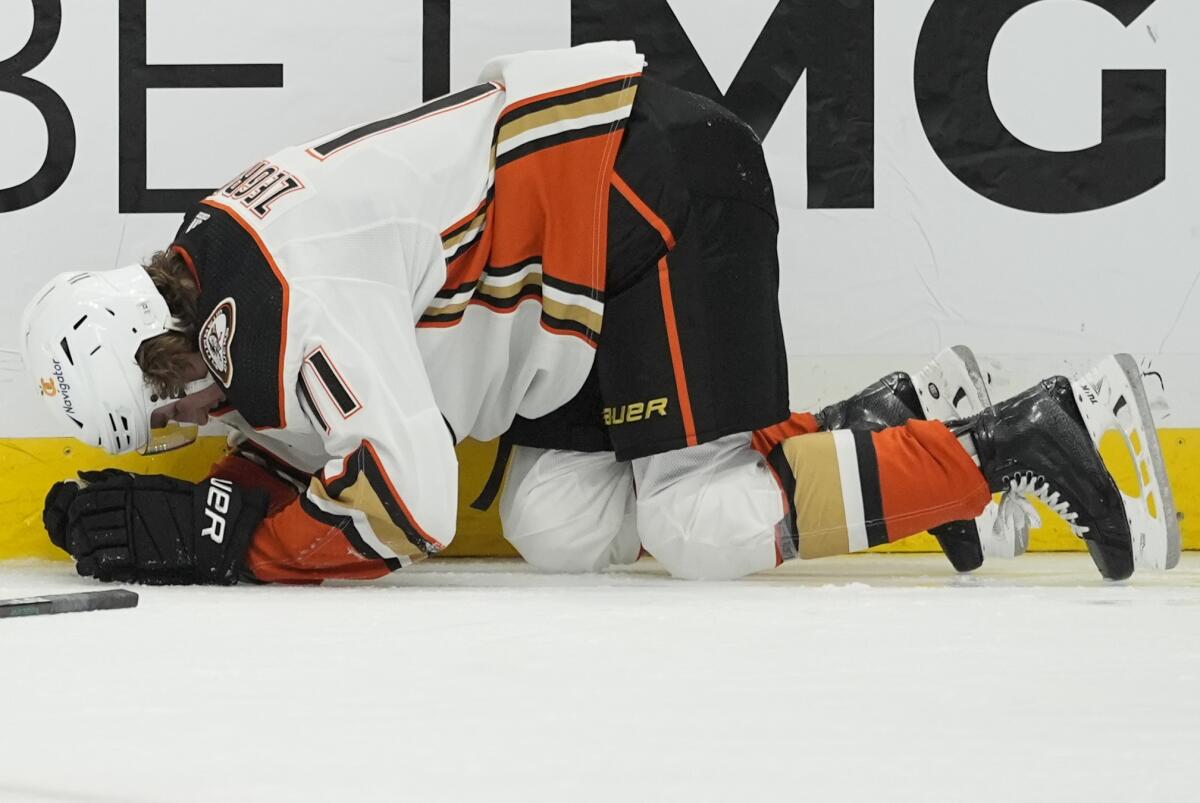 Ducks forward Trevor Zegras falls to the ice after sustaining a broken ankle against the Nashville Predators on Tuesday.