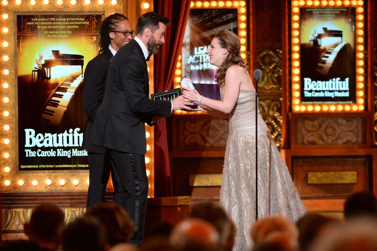 Hugh Jackman presents Jessie Mueller with the award for best performance by an actress in a leading role in a musical for "Beautiful."