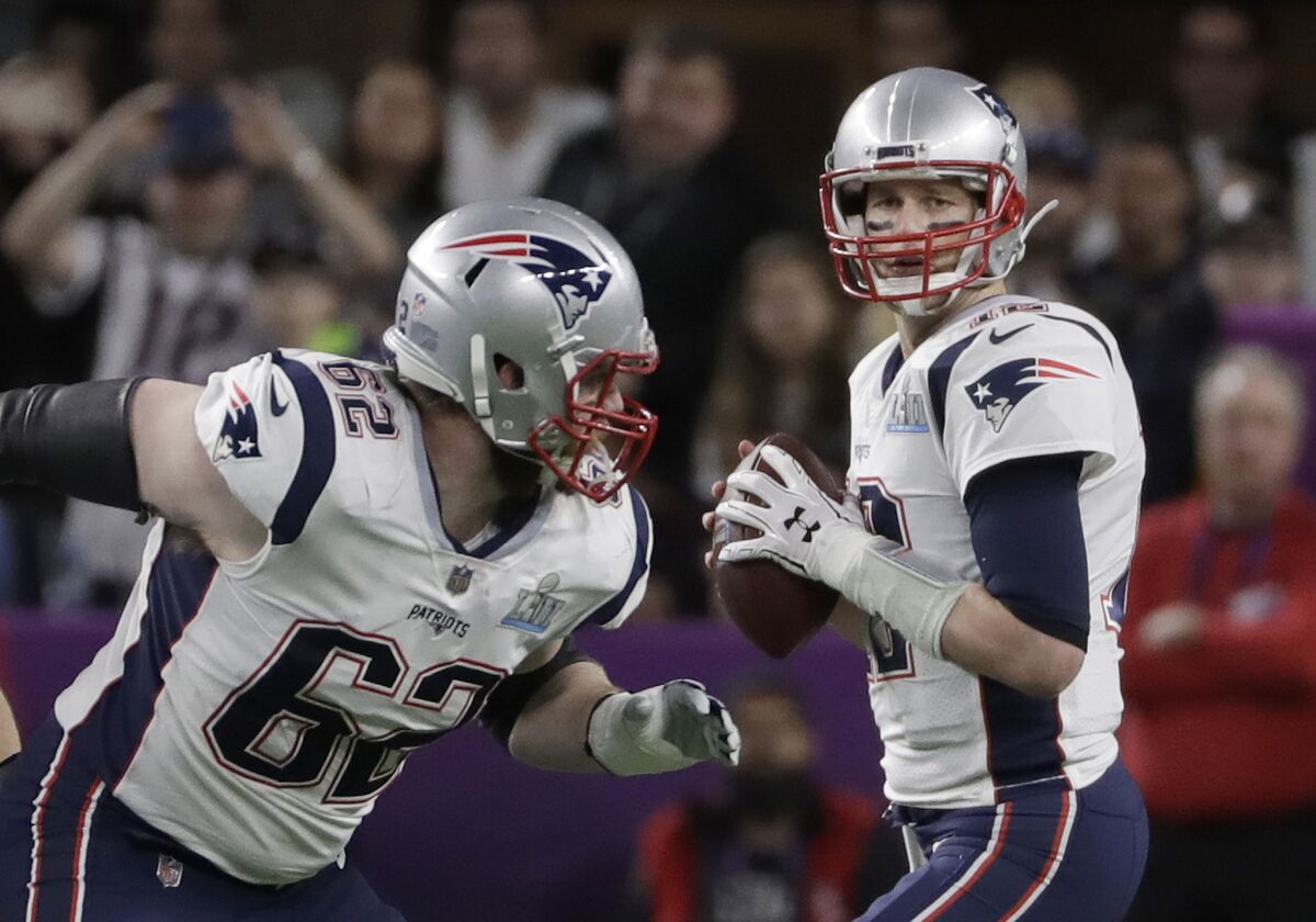 Patriots quarterback Tom Brady looks to pass during the first quarter.