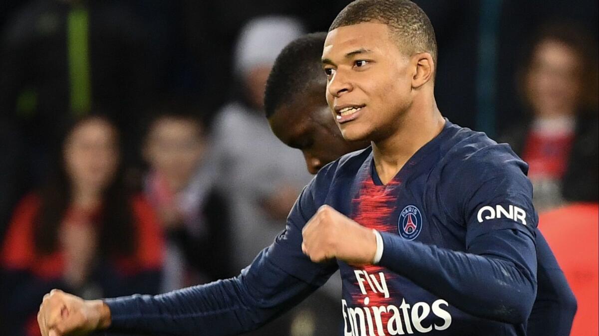 Paris Saint-Germain's French forward Kylian Mbappe celebrates scoring his team's third goal Saturday.