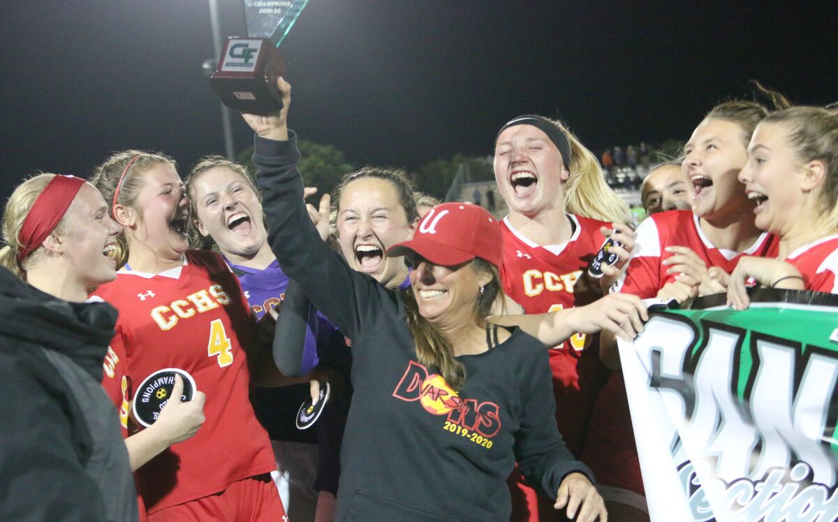 Cathedral Head Coach Dawn Lee and the CIF trophy.