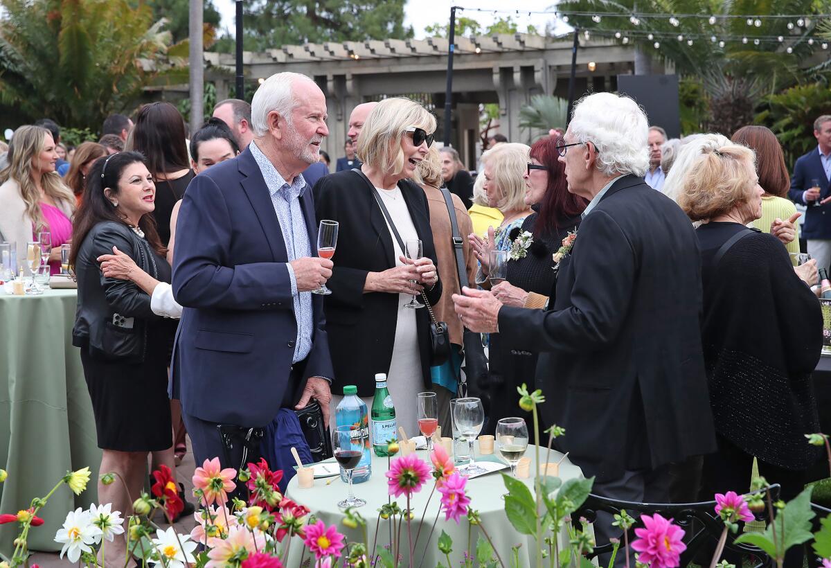 Guests attend the the "Grow the Gardens" campaign party.