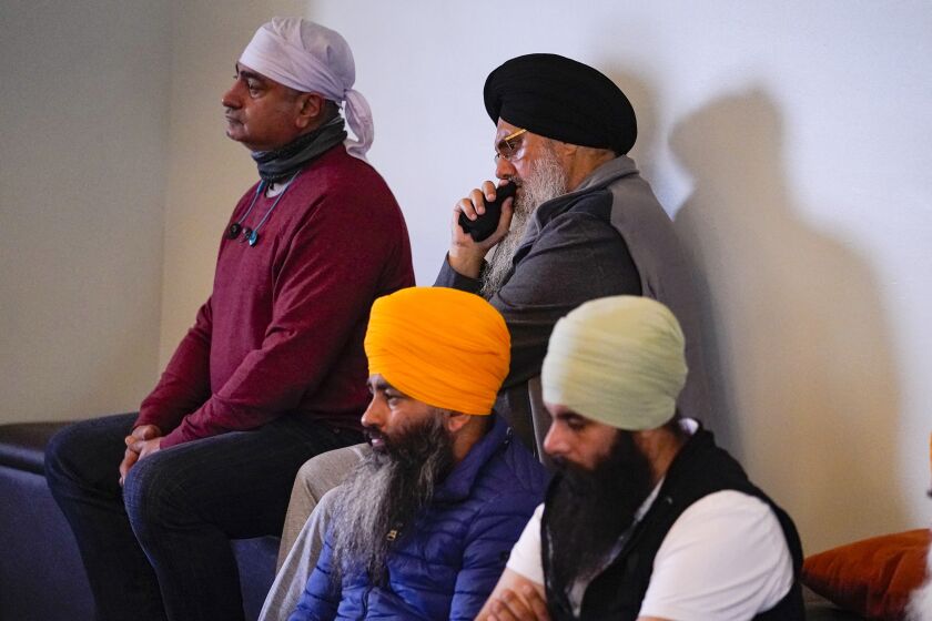 Members of the Sikh Coalition gather at the Sikh Satsang of Indianapolis in Indianapolis, Saturday, April 17, 2021 to formulate the groups response to the shooting at a FedEx facility in Indianapolis that claimed the lives of four members of the Sikh community. A gunman killed eight people and wounded several others before taking his own life in a late-night attack at a FedEx facility near the Indianapolis airport. (AP Photo/Michael Conroy)