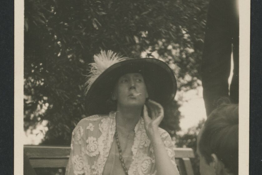Virginia Woolf enjoying a smoke in Garsington, England, 1923.
