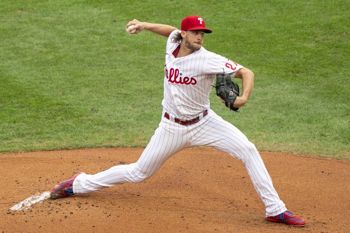 Philadelphia Phillies starting pitcher Aaron Nola throws a pitch during the first inning of a baseball game against the New York Mets, Saturday, Aug. 15, 2020, in Philadelphia. (AP Photo/Chris Szagola)