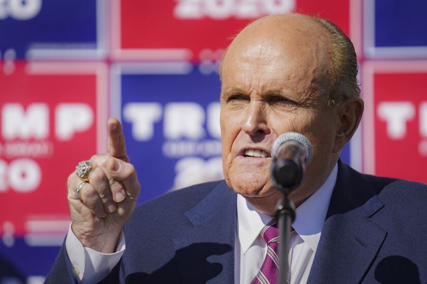 Former New York mayor Rudy Giuliani, a lawyer for President Donald Trump,speaks during a news conference at Four Seasons Total Landscaping on legal challenges to vote counting in Pennsylvania, Saturday Nov. 7, 2020, in Philadelphia.
