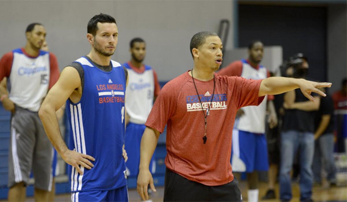 Guard J.J. Redick, left, had 14 points in his first games for the Clippers in L.A.'s 103-99 preseason win over the Utah Jazz at Staples Center on Wednesday.