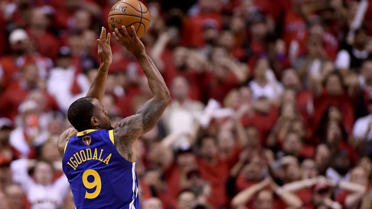 Golden State Warriors' Andre Iguodala (9) shoots against the Toronto Raptors during the second half of Game 2.