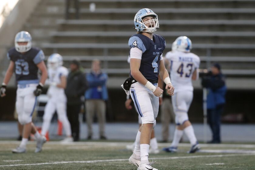 Corona del Mar quarterback Ethan Garbers reacts after completing a touchdown reception to Bradley Schlom, not pictured, during the first half against Serra in the CIF State a Division 1-A title game at Cerritos College on Saturday. This touchdown gave the Sea Kings a 14-7 lead.