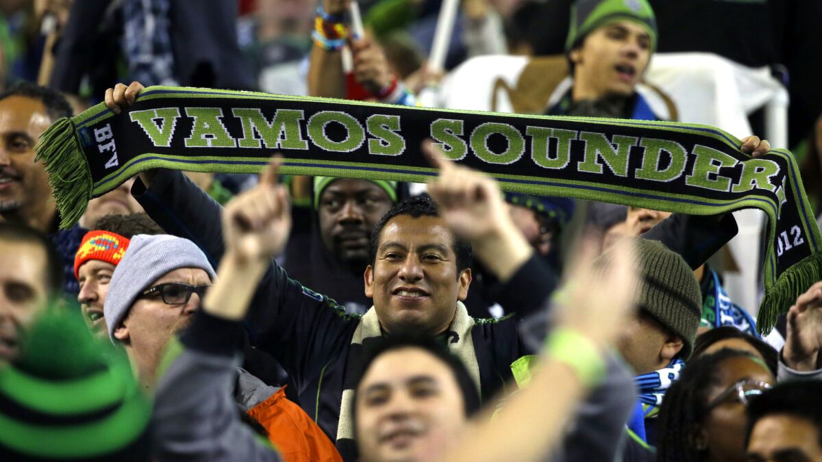 Seattle Sounders fans celebrate after the team's playoff series victory over FC Dallas on Nov. 10.