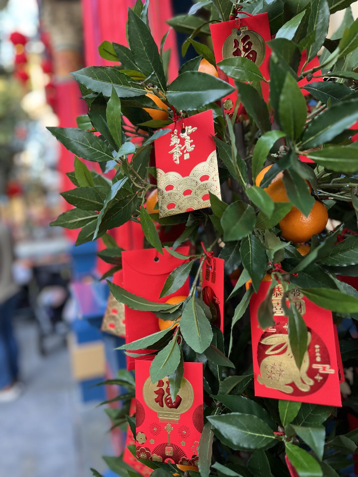 Decorations at California Adventure highlight the tradition of lucky red envelopes for Lunar New Year.