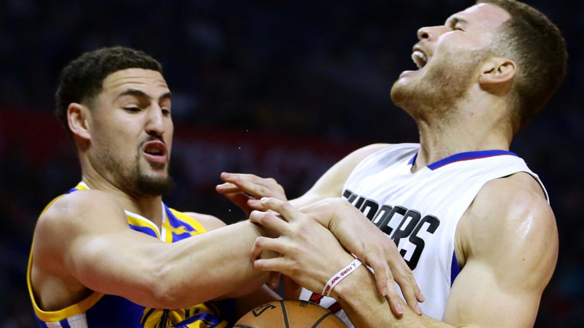 Clippers forward Blake Griffin is fouled by Warriors guard Klay Thompson during the first half.