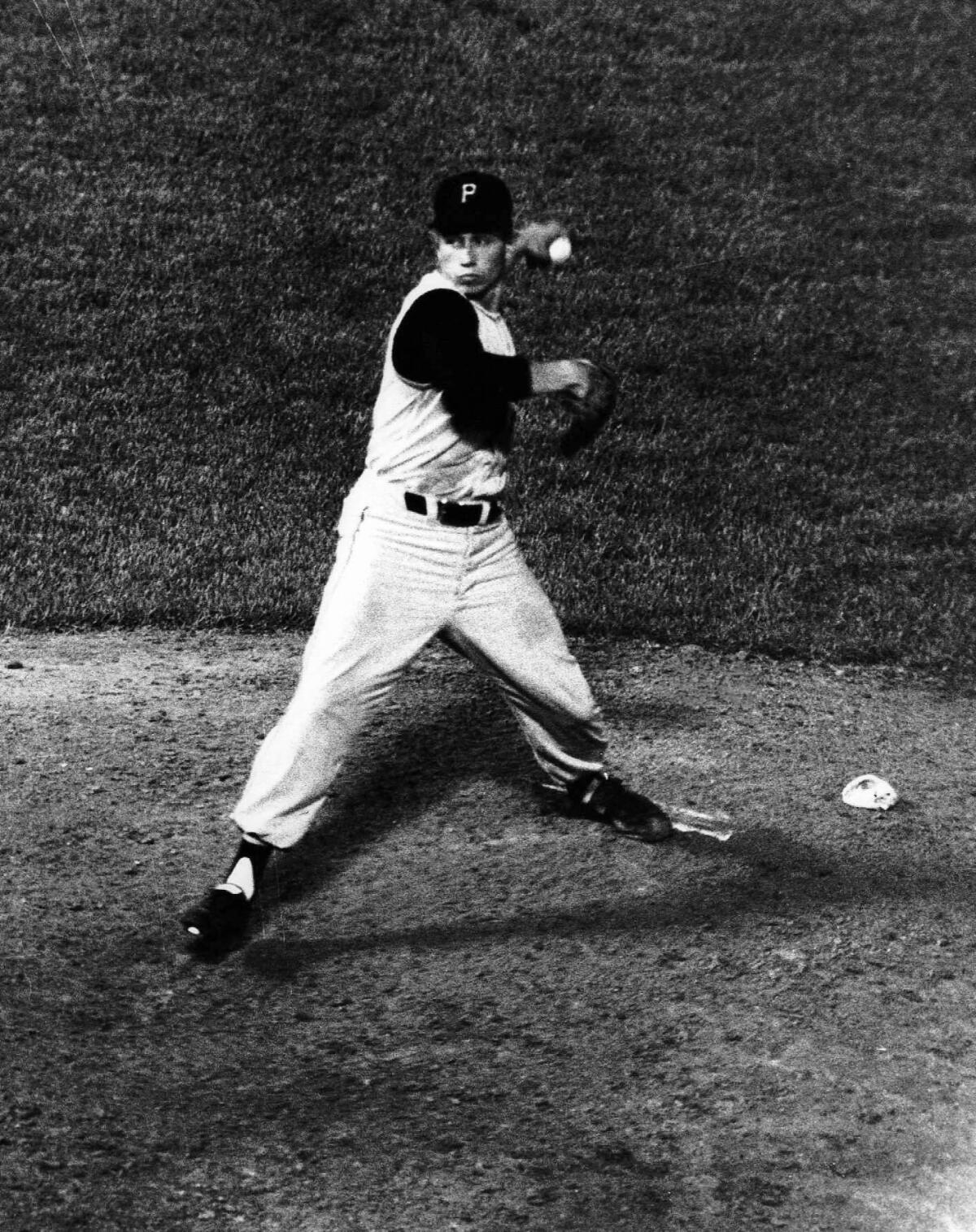 Pittsburgh Pirates pitcher Harvey Haddix throws during one of his 12 perfect innings against the Milwaukee Braves on May 26, 1959, in Milwaukee. Haddix was perfect through 12 but ended up losing the game in the 13th, 1-0.