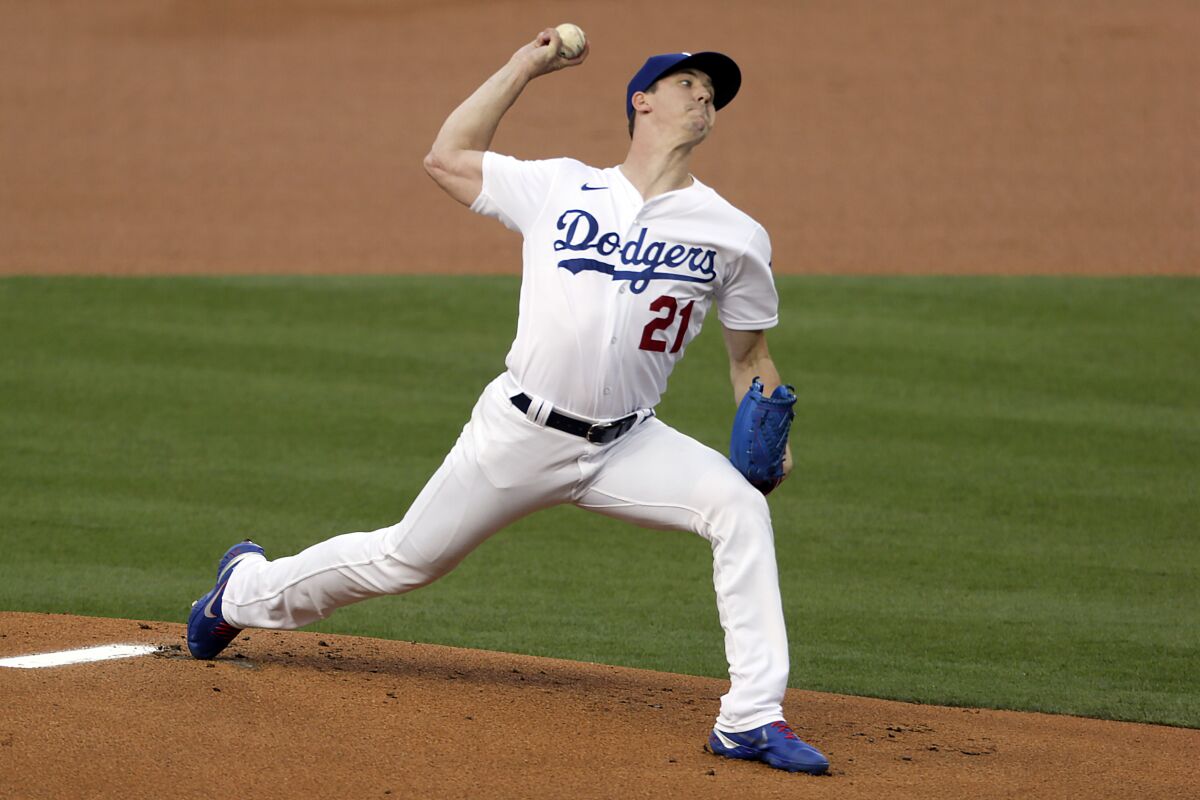 The Los Angeles Dodgers' Walker Buehler pitches against the Colorado Rockies on Aug. 21, 2020.